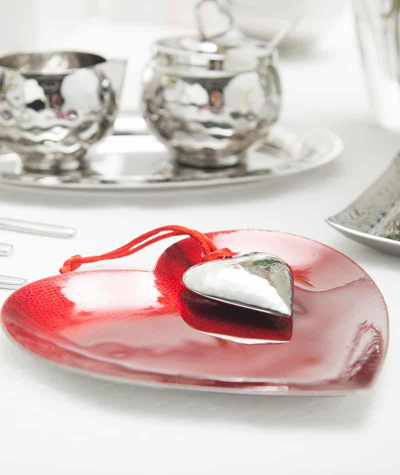 A Valentine’s Day table with the scarlet red heart tray from the Symphony collection