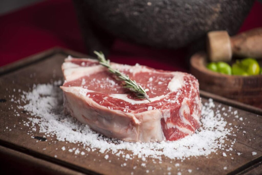 A raw steak on a cutting board