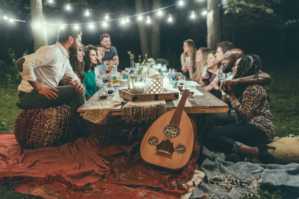 A group of friends sitting around a table at night