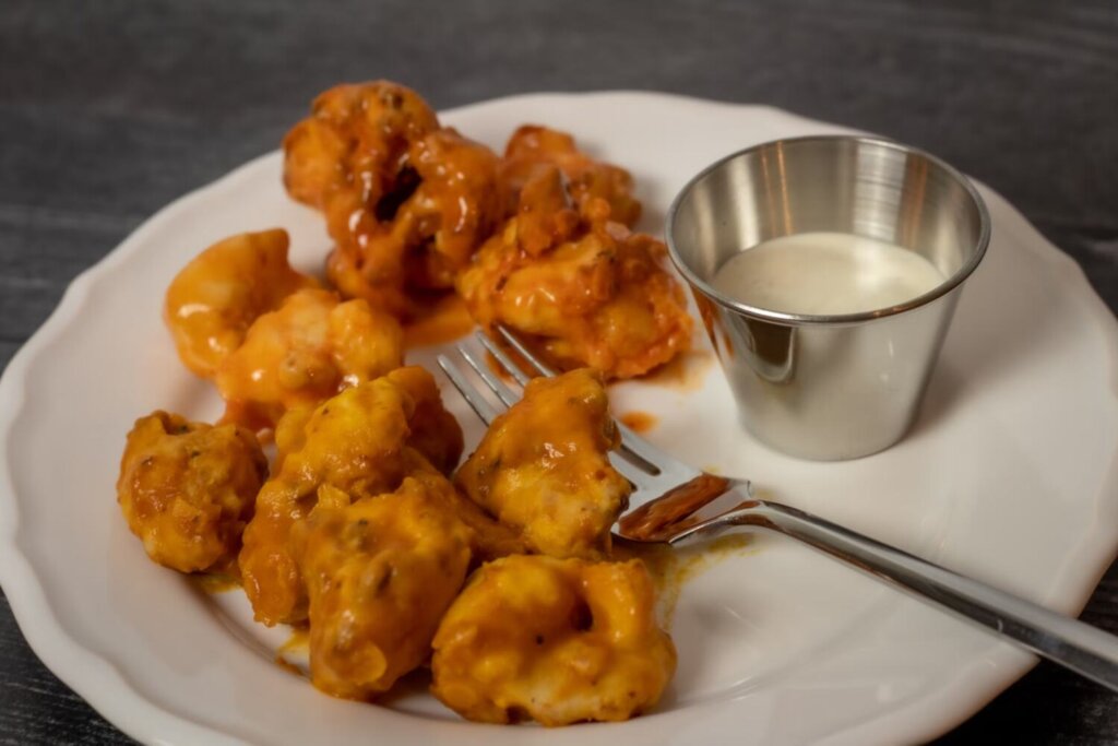 Roasted Buffalo cauliflower bites on a plate