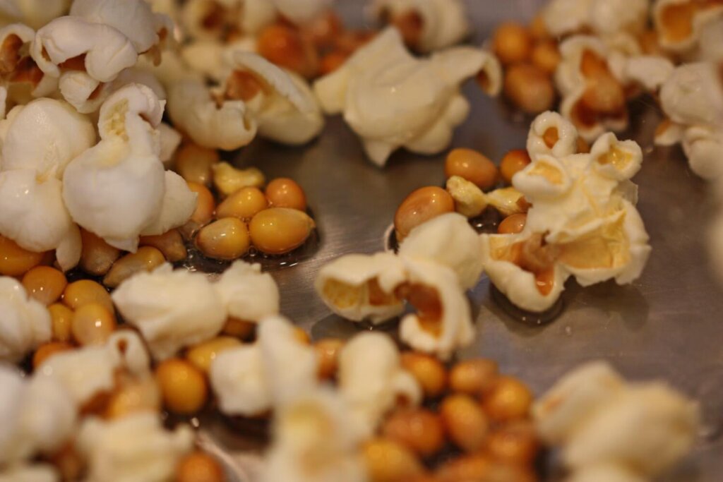 Popped and unpopped popcorn in a pan