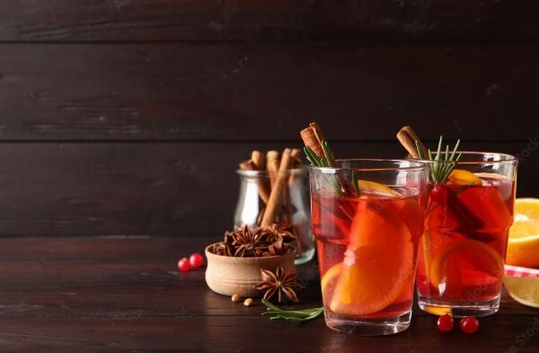 Spiced gin cocktails on a wooden table